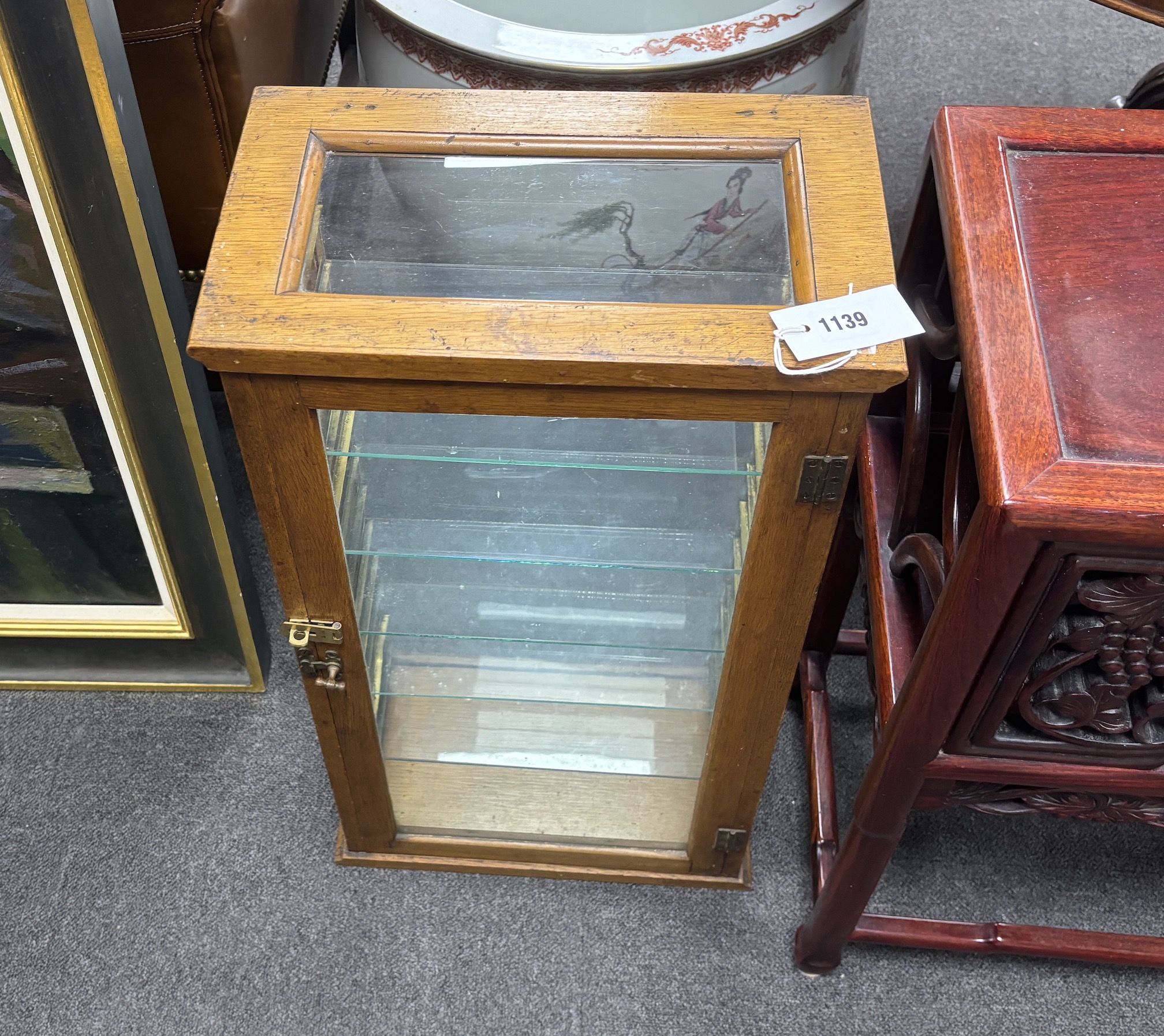 A late 19th/early 20th century glazed oak shop display case, width 37cm, depth 22cm, height 68cm